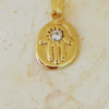 gold and diamond hamsa necklace,